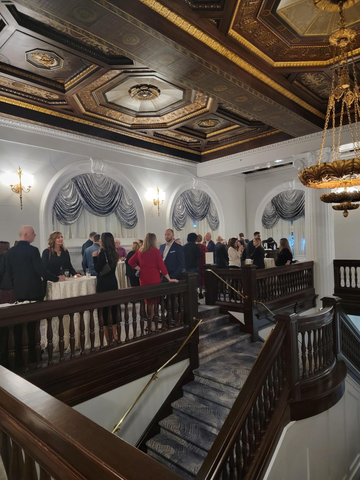 Guests Enjoying Appetizers at the Symplicity Communications Holiday Party